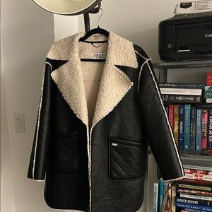 Black faux-leather coat with shearling effect | Joelle